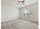 Bedroom featuring a ceiling fan, natural light from the window, and neutral walls at 5355 Hackberry Sw Ln, Concord, NC 28027