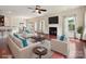 Cozy living room with fireplace, hardwood floors and bright, natural lighting at 5355 Hackberry Sw Ln, Concord, NC 28027