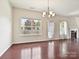 Bright living room with hardwood floors, fireplace, and backyard view at 5355 Hackberry Sw Ln, Concord, NC 28027