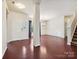 Open living space featuring hardwood floors, natural light, and a view to the staircase at 5355 Hackberry Sw Ln, Concord, NC 28027