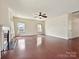 Spacious living room with hardwood floors and a decorative fireplace at 5355 Hackberry Sw Ln, Concord, NC 28027
