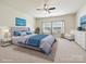 Staged bedroom with plush bedding, natural light and decor at 5355 Hackberry Sw Ln, Concord, NC 28027
