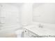 Bright bathroom features a tub-shower, a white sink vanity and a large mirror at 5594-C Galloway Dr # 99P, Stanfield, NC 28163