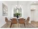 Elegant dining room featuring a glass table with seating for six and modern chandelier lighting at 5594-C Galloway Dr # 99P, Stanfield, NC 28163