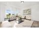 Bright living room with large windows, comfortable seating, stylish decor, and an inviting atmosphere at 5594-C Galloway Dr # 99P, Stanfield, NC 28163
