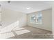 A bedroom with carpet, natural light from the window and neutral paint at 5634-A Galloway Dr # 96P, Stanfield, NC 28163