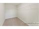 A walk-in closet with carpet and shelving, offering ample storage space at 5634-A Galloway Dr # 96P, Stanfield, NC 28163