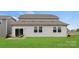 Spacious backyard featuring a well-maintained lawn and a patio area ideal for outdoor seating and relaxation at 566 Mountain View Dr, Monroe, NC 28110