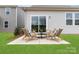 Backyard patio featuring outdoor furniture on a manicured lawn at 566 Mountain View Dr, Monroe, NC 28110