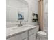 Clean bathroom featuring a vanity with stone countertop and a shower/tub combo at 566 Mountain View Dr, Monroe, NC 28110