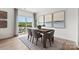 Inviting dining area with natural light and views of the outdoor space at 566 Mountain View Dr, Monroe, NC 28110