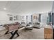 Spacious game room with comfortable seating, foosball table, and decorative elements for entertainment at 566 Mountain View Dr, Monroe, NC 28110
