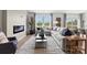 Living room showcasing a comfortable sectional sofa, fireplace, and ample natural light from large windows at 566 Mountain View Dr, Monroe, NC 28110