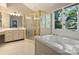 Spacious bathroom with soaking tub and glass shower at 5917 Summerston Pl, Charlotte, NC 28277
