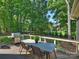 Spacious deck with room for dining and grilling overlooking a private, wooded backyard at 5917 Summerston Pl, Charlotte, NC 28277