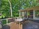 Spacious deck with room for dining and grilling overlooking a private, wooded backyard at 5917 Summerston Pl, Charlotte, NC 28277