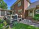 Brick home with a screened porch, deck, manicured landscaping, and a lush lawn at 5917 Summerston Pl, Charlotte, NC 28277