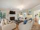 Large living room with fireplace, built-in shelving, and comfortable seating area at 5917 Summerston Pl, Charlotte, NC 28277