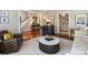 Open living room with hardwood floors, a round coffee table, and comfortable seating, blending style and comfort at 5917 Summerston Pl, Charlotte, NC 28277