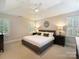 Relaxing main bedroom with neutral colors and a ceiling fan at 5917 Summerston Pl, Charlotte, NC 28277