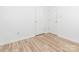 This bedroom featuring wood-look floors also features direct access to closet space at 6212 Derryfield Dr, Charlotte, NC 28213