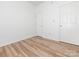 Neutral bedroom featuring durable wood-look flooring and ample closet space at 6212 Derryfield Dr, Charlotte, NC 28213