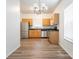 A modern kitchen with stainless steel appliances and ample counter space at 6212 Derryfield Dr, Charlotte, NC 28213