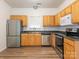 Well-lit kitchen boasts stainless steel appliances and sleek countertops at 6212 Derryfield Dr, Charlotte, NC 28213
