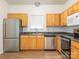 A well-lit kitchen featuring stainless steel appliances and plenty of cabinet space at 6212 Derryfield Dr, Charlotte, NC 28213