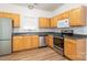 Well-appointed kitchen with modern stainless appliances, wood cabinets, and ample counter space at 6212 Derryfield Dr, Charlotte, NC 28213
