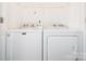 Convenient laundry room featuring a Maytag washer and dryer for effortless chores at 6212 Derryfield Dr, Charlotte, NC 28213