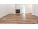 Spacious living room featuring a fireplace and stylish wood-look flooring at 6212 Derryfield Dr, Charlotte, NC 28213