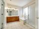Spacious bathroom featuring double vanity, soaking tub, and glass-enclosed shower at 720 Kingsmill Ln, Clover, SC 29710