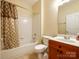 Full bathroom with a shower-tub combo, vanity, and neutral color palette at 720 Kingsmill Ln, Clover, SC 29710
