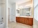 Spacious bathroom featuring a double sink vanity, tiled floors, and a shower-tub combo at 720 Kingsmill Ln, Clover, SC 29710