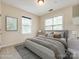 Well-lit bedroom with a large window, neutral colors, and stylish furnishings at 720 Kingsmill Ln, Clover, SC 29710