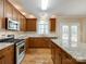 Spacious kitchen featuring granite countertops, stainless steel appliances, and a large island at 720 Kingsmill Ln, Clover, SC 29710