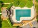 Aerial view of a community pool with a large sun deck, lounge chairs, and landscaping at 720 Kingsmill Ln, Clover, SC 29710