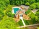Aerial view of a community pool, surrounded by lush greenery, parking, and ample seating at 720 Kingsmill Ln, Clover, SC 29710