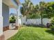 Private back yard with white fence, patio, and palm trees for a tranquil retreat at 757 Shady Grove Xing, Fort Mill, SC 29708