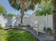 Secluded back yard deck area with rocking chairs shaded by a mature palm tree at 757 Shady Grove Xing, Fort Mill, SC 29708