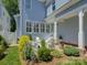 Beautiful backyard patio with landscaped garden and comfortable lounge chairs for relaxation at 757 Shady Grove Xing, Fort Mill, SC 29708