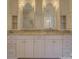 Upscale bathroom boasts and vanities, marble countertops, and plenty of cabinet space at 757 Shady Grove Xing, Fort Mill, SC 29708