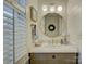 Charming bathroom with a stylish mirror, white vanity, and natural light at 757 Shady Grove Xing, Fort Mill, SC 29708