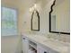 Elegant bathroom with dual sinks, decorative mirrors, and ample counter space at 757 Shady Grove Xing, Fort Mill, SC 29708