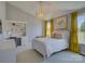 Comfortable bedroom with a classic white bed, desk, and natural light at 757 Shady Grove Xing, Fort Mill, SC 29708