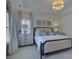 Elegant bedroom with tray ceilings, chandelier, decorative pillows, and lots of natural light at 757 Shady Grove Xing, Fort Mill, SC 29708