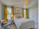 Sunny bedroom featuring a white bed, bright yellow curtains, and stylish decor at 757 Shady Grove Xing, Fort Mill, SC 29708