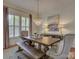 Elegant dining room with a large wooden table, stylish chairs, and a decorative chandelier at 757 Shady Grove Xing, Fort Mill, SC 29708