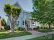 Charming light blue home featuring a brick walkway, inviting front porch, and beautifully landscaped front yard at 757 Shady Grove Xing, Fort Mill, SC 29708